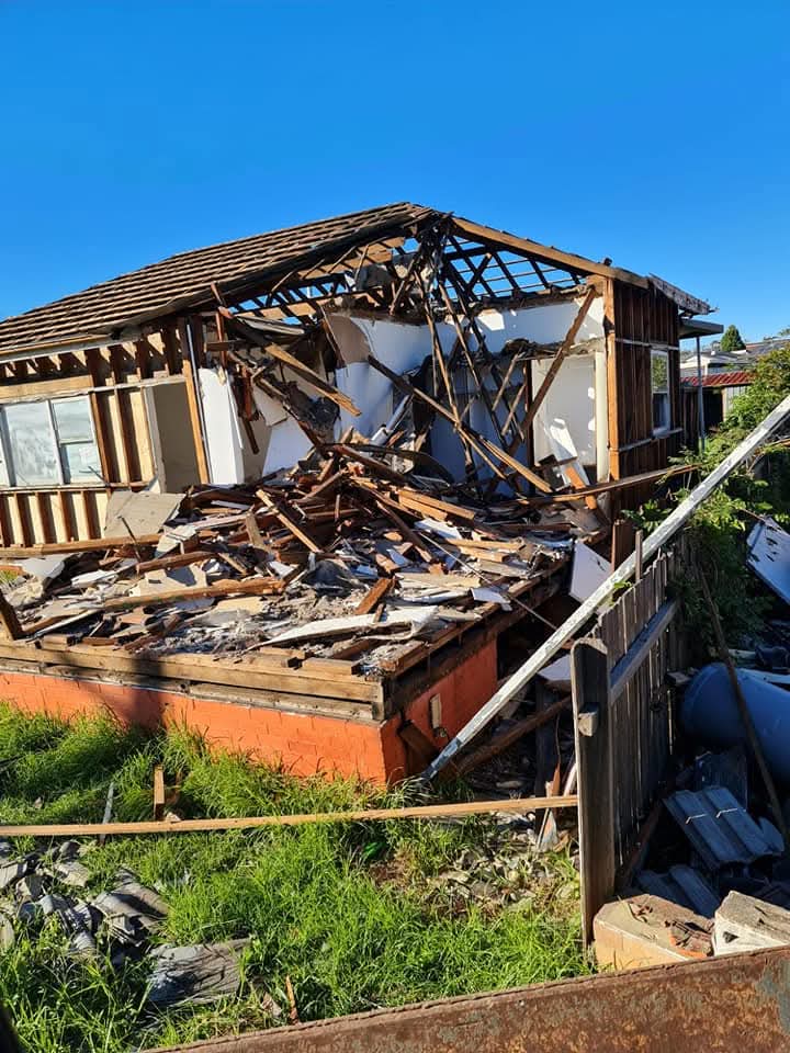 Weatherboard cottage mid-demolition